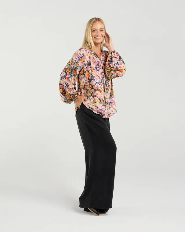 Model wearing Monet's Garden Phoebe Gathered Sleeve Top By Blackstone Available at Beetees Nelson