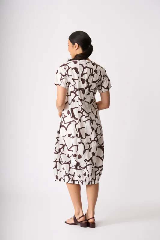 Model wearing Uspa- Daisy Pleated Maxi Dress By Foil Available at Beetees Nelson