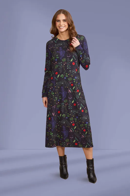 Model wearing Halo Longline Swing Knit Dress By Vassalli Available at Beetees Nelson