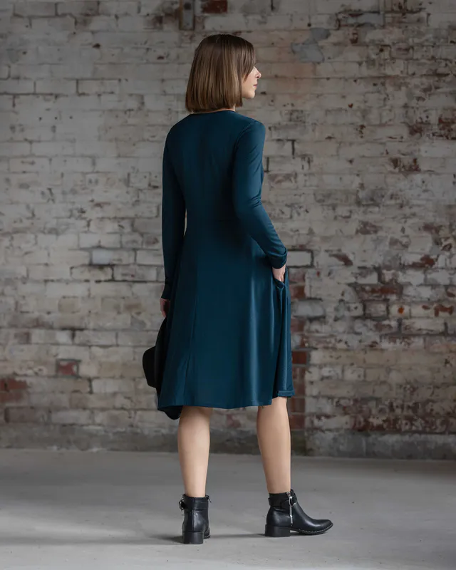 Model wearing Dragonfly Lotus Merino Dress By Vassalli Available at Beetees Nelson