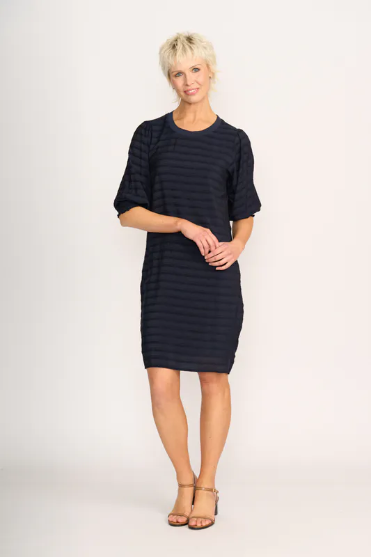 Model wearing Navy Stripe For Shirr Dress By Preen Available at Beetees Nelson