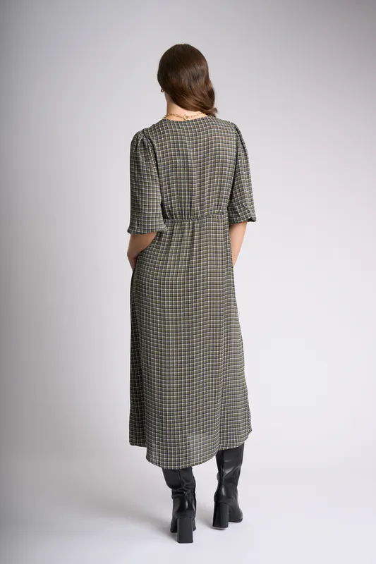 Model wearing Line Work Cuff & Flow Dress By Foil Available at Beetees Nelson