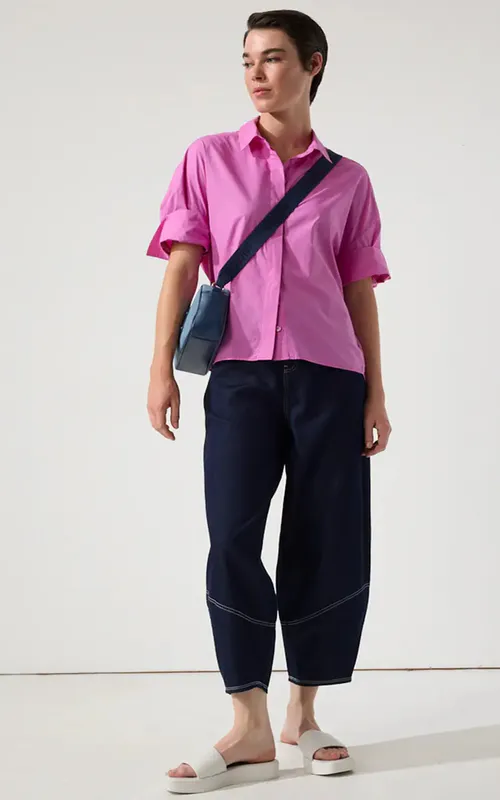 Model wearing  Dark Denim Denim Barrel Leg Pant By Marco Polo Available at Beetees Nelson