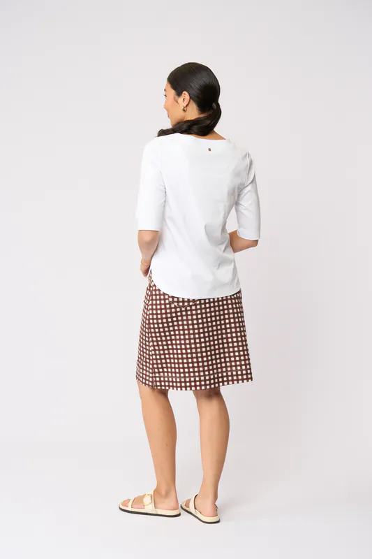 Model wearing Check IT Tee-Rific Skirt - Printed By Esplanade Available at Beetees Nelson