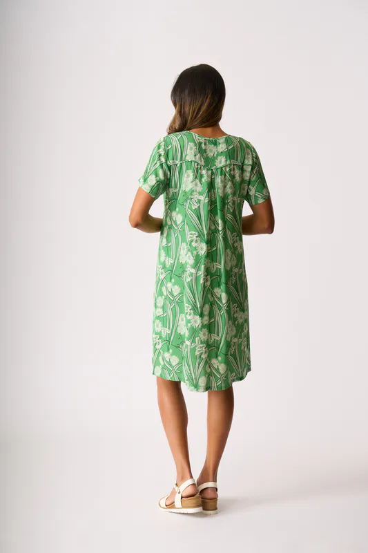 Model wearing Ode Dress - Swing Back By Foil Available at Beetees Nelson