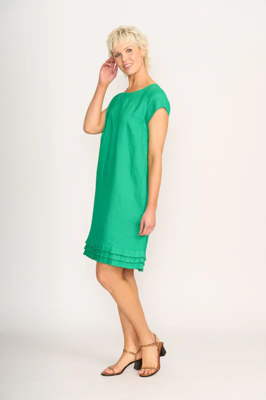 Model wearing green Dress - Pleat Dreams By Foil Available at Beetees Nelson