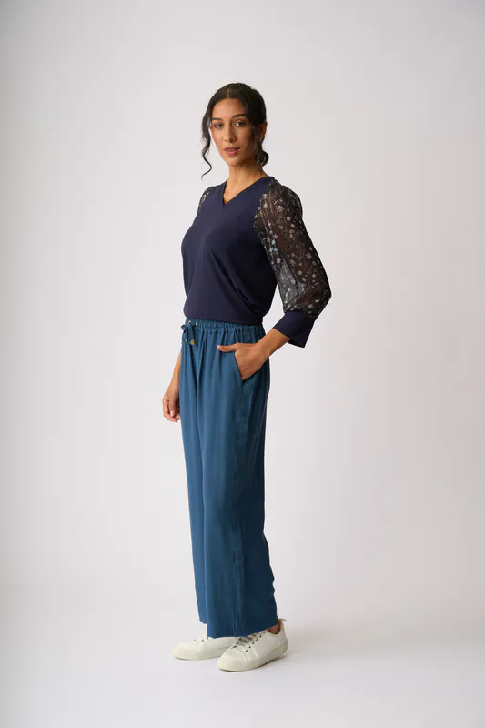 Model wearing Twilight Floral Contrast Woven Shoulder Top By Memo Available at Beetees Nelson