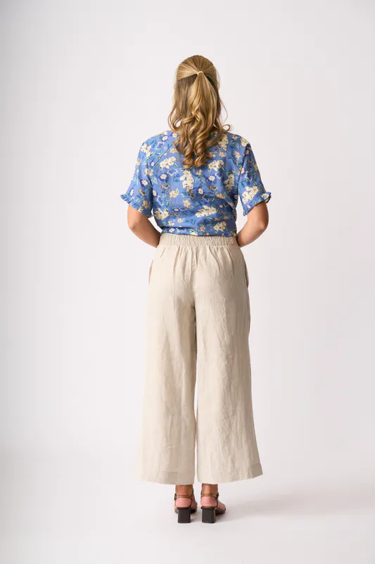 Model wearing Denim Delight Ruffles & Scoop Hem Top By Foil Available at Beetees Nelson