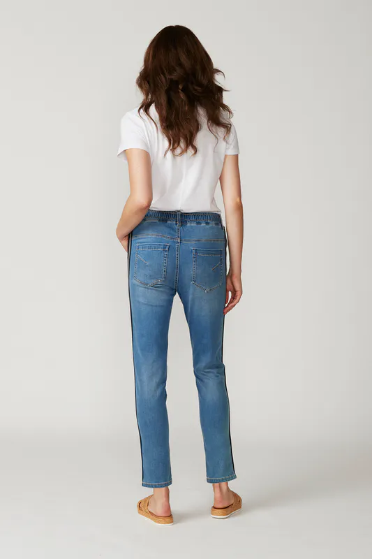 Model wearing distressed LTL Boyfriend Jean By Lania Available at Beetees Nelson