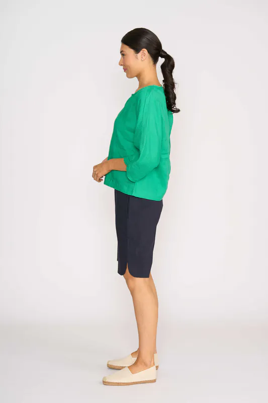 Model wearing Green Plot Twist Top By Foil Available at Beetees Nelson