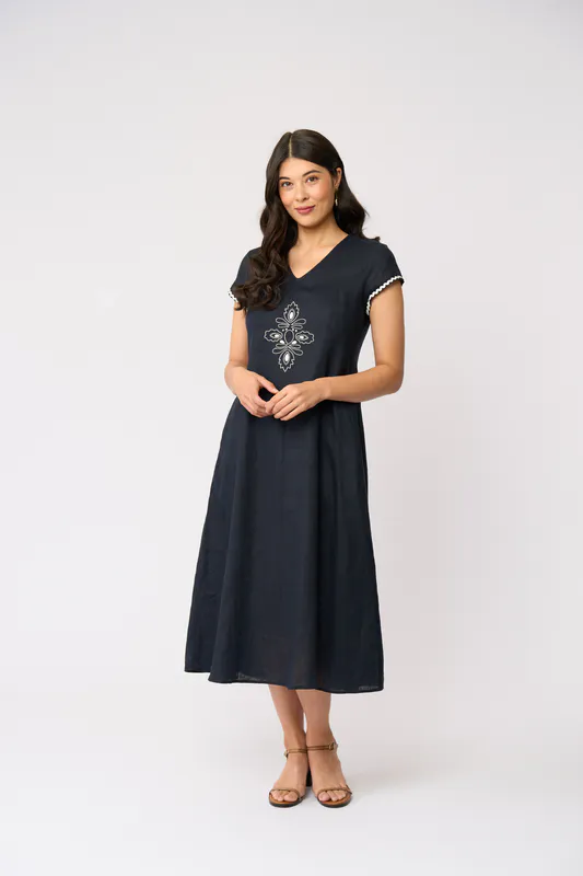 Model wearing True Navy Folk Yeah Dress By Foil Available at Beetees Nelson