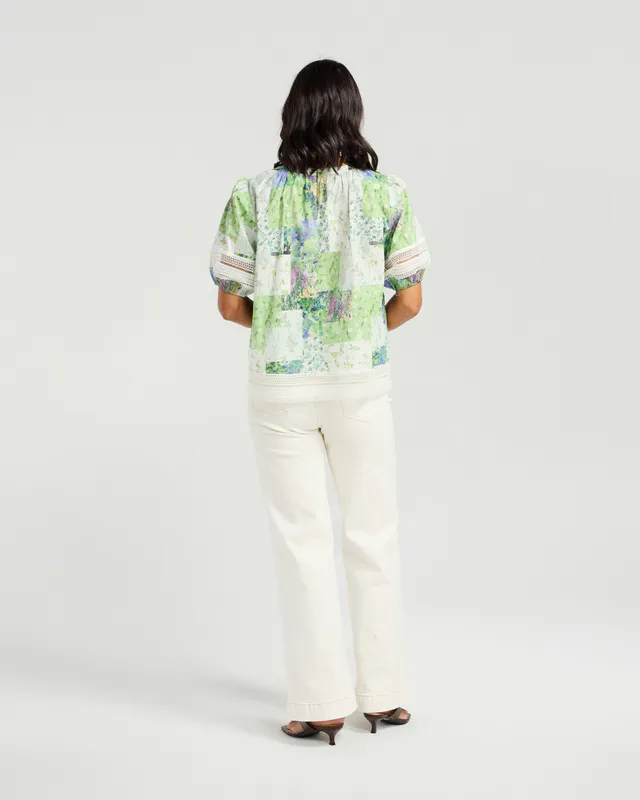 Model wearing Botanical Patch Paige Top By NMBR Rose Available at Beetees Nelson