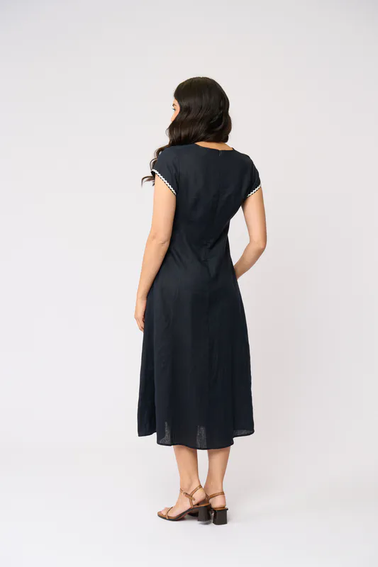 Model wearing True Navy Folk Yeah Dress By Foil Available at Beetees Nelson