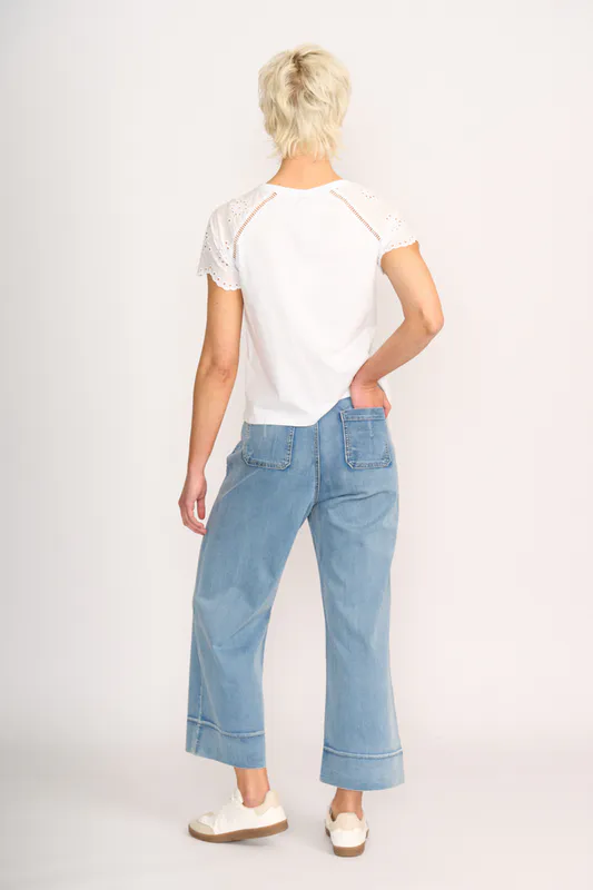 Model wearing White T-Shirt - Broderie Sleeve By Memo Available at Beetees Nelson