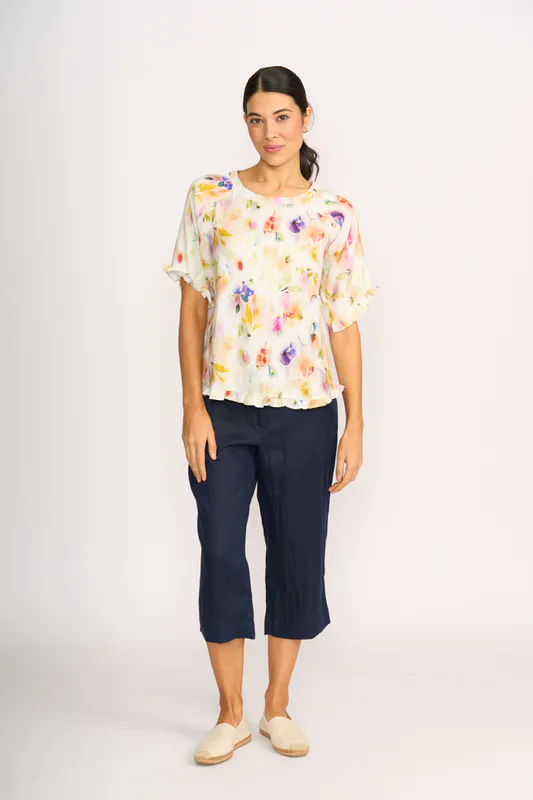 Model wearing Mist Floral Top - Ruffles & Scoop Hem By Preen Available at Beetees Nelson