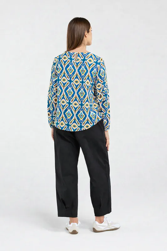 Model wearing Regatta Blue Aztec Skylar Pintuck Sleeve Top By Blackstone Available at Beetees Nelson