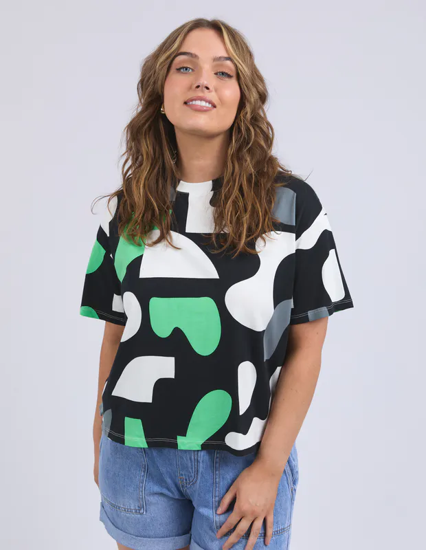 Model wearing Charcoal Stijl Tee By Elm Available at Beetees Nelson