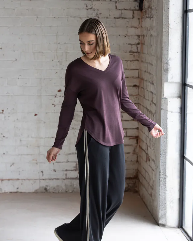Model wearing Dragonfly Veni Merino Top By Vassalli Available at Beetees Nelson