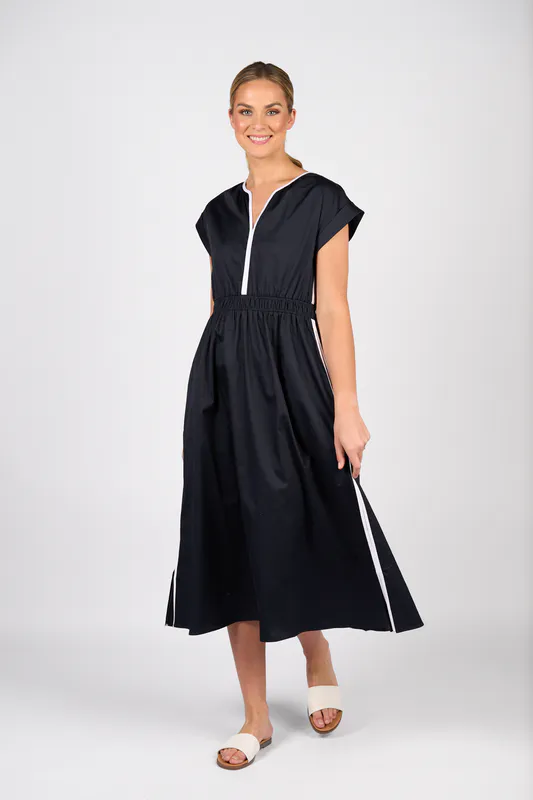 Model wearing Ink/White V-Neck Shirred Waist Dress with Contrast Trim and Pockets By Vassalli Available at Beetees Nelson