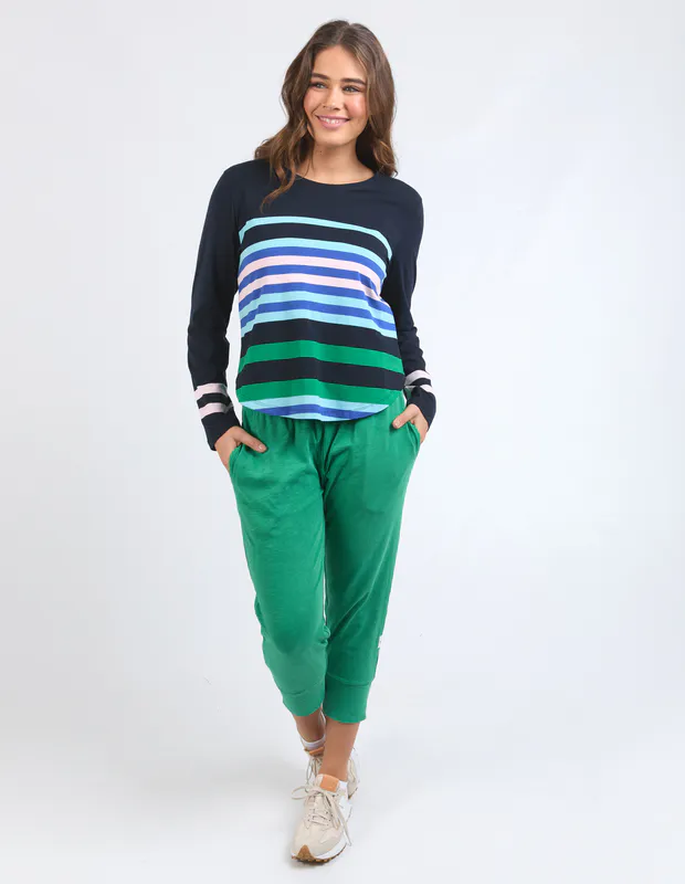 Model wearing Medley Stripe Long Sleeve Navy Available at Beetees Nelson