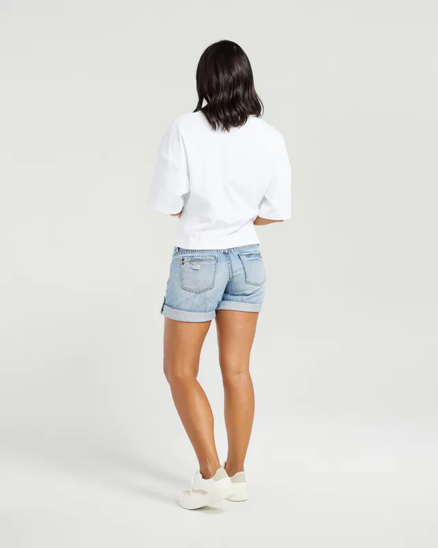 Model wearing White Kendell T-shirt By NMBR Rose Available at Beetees Nelson