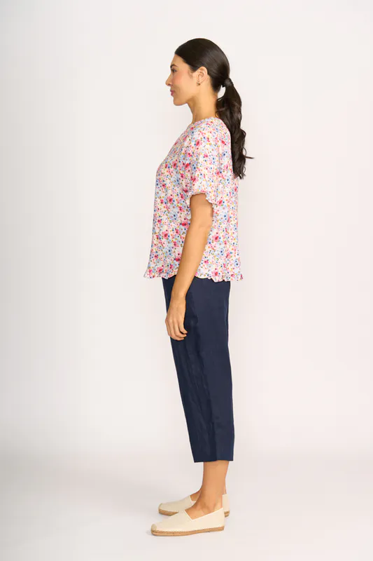 Model wearing Romantic Blooms Top - Ruffles & Scoop Hem By Preen Available at Beetees Nelson