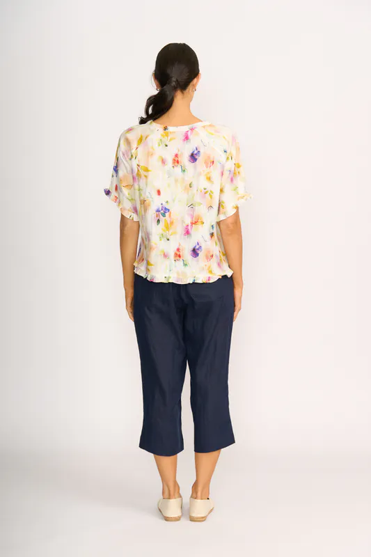 Model wearing Mist Floral Top - Ruffles & Scoop Hem By Preen Available at Beetees Nelson