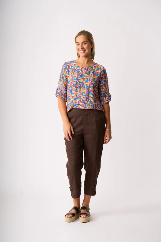 Model wearing Dashed Out Ruffle Sleeve Scoop Top By Foil Available at Beetees Nelson