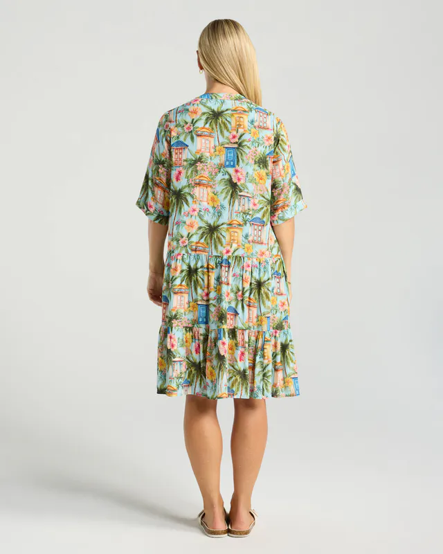 Model wearing Emerald Cross Dye Rosanna Short Tiered Dress By Blackstone Available at Beetees Nelson