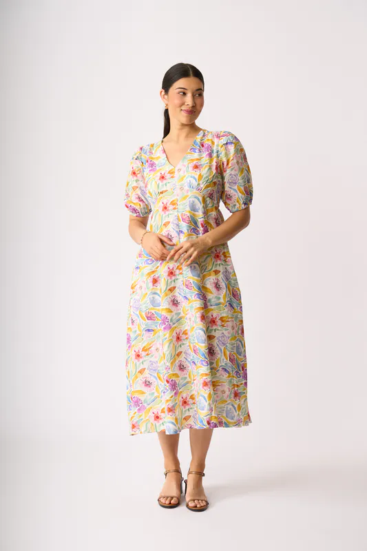 Model wearing Bright Blooms Empire-Ly Yours Dress By Foil Available at Beetees Nelson