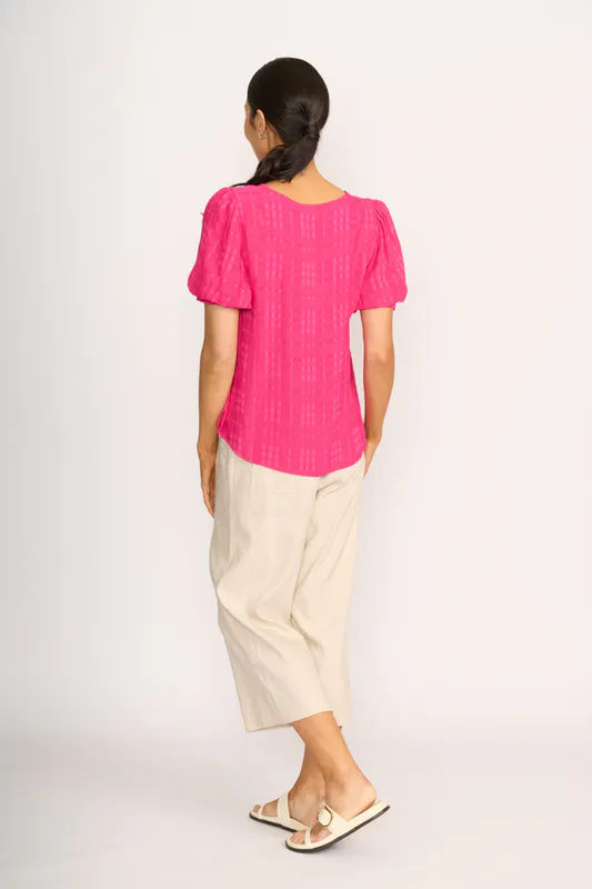 Model wearing Pink Top - Volume Sleeve, Scoop Hem By OH Three Available at Beetees Nelson