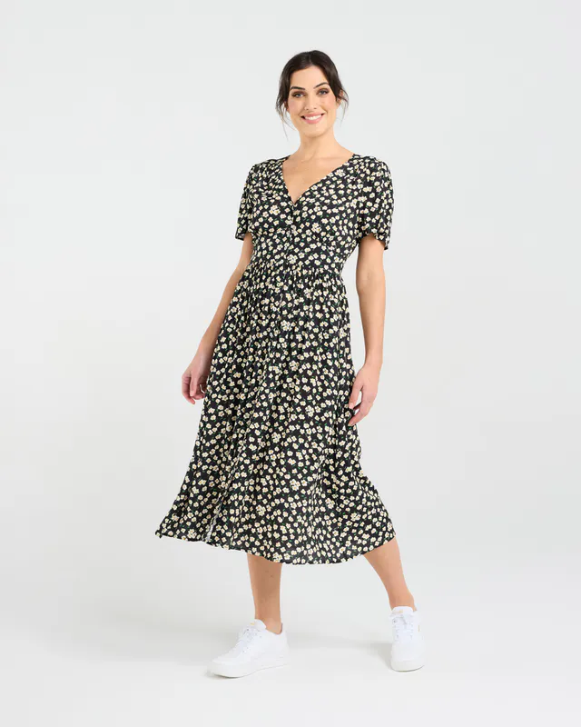 Model wearing Daisy Chain Print Gigi V-neck Button Front Dress By Blackstone Avaialble at Beetees Nelson