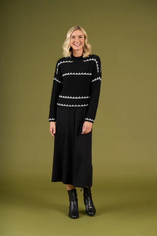 Model wearing Mono Stripe Mackenzie Knit By Charlie Jane Available at Beetees Nelson