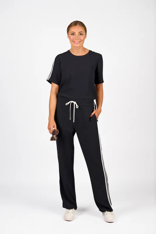 Model wearing Ink/Off White Universal Jumpsuit By Knewe Available at Beetees Nelson
