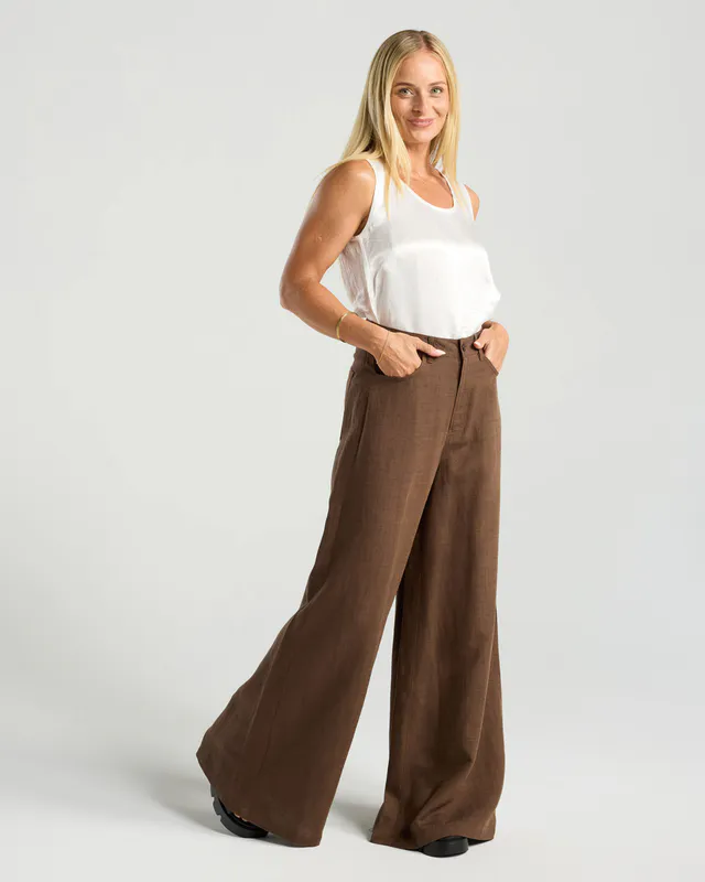 Model wearing Chocolate Leonora Palazzo Linen Pant By Blackstone Available at Beetees Nelson
