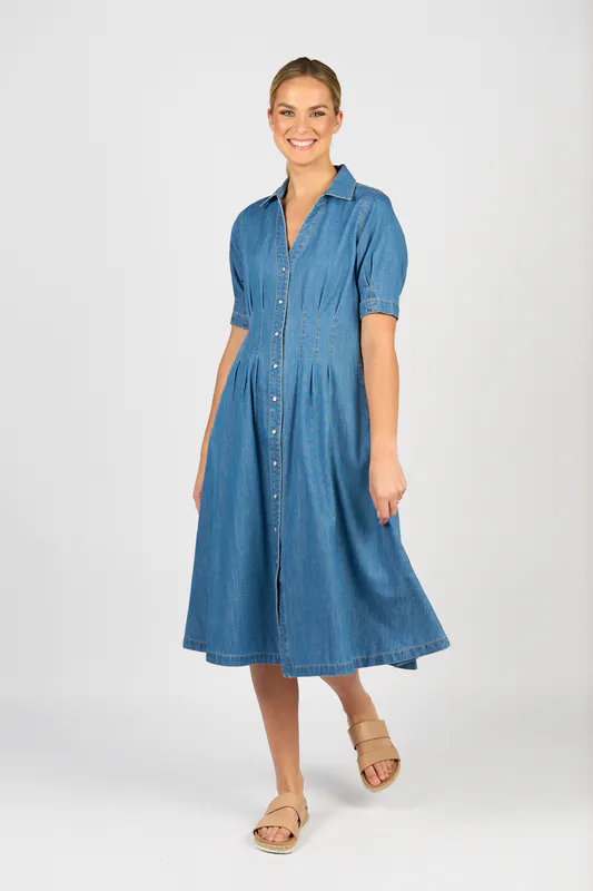 Model wearing Mid Wash Shaped Waist Button-Up Dress with Pockets By Vassalli Available at Beetees Nelson