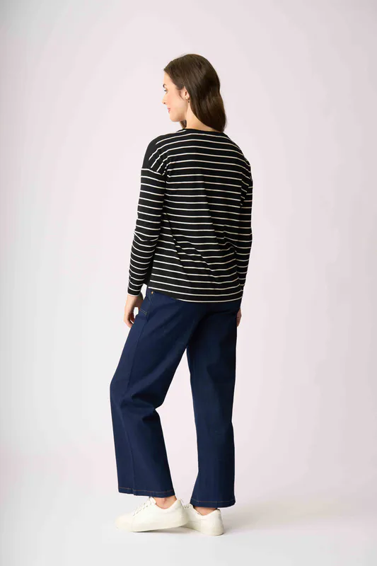 Model wearing Metallic Birds Drop Shoulder Top By Foil Available at Beetees Nelson