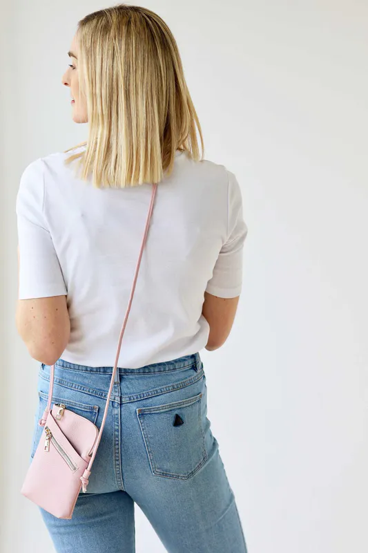 Model wearing Pale Pink Long Cross Body Shoulder Strap Bag By Archer House Available at Beetees Nelson