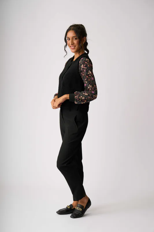 Model wearing Black Rib Button Front Vest By Oh Three Available at Beetees Nelson