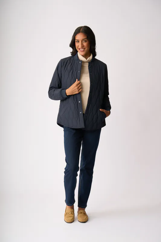 Model wearing Midnight Quilted Snap Jacket By Foil Available at Beetees Nelson