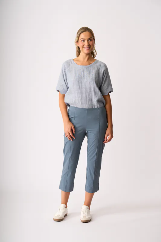 Model wearing Pale Blue Cross Dye Scalloped Top By Foil Available at Beetees Nelson