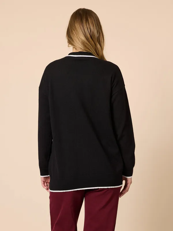 Model wearing Black Slalom Heart Cardi By Threadz Available at Beetees Nelson