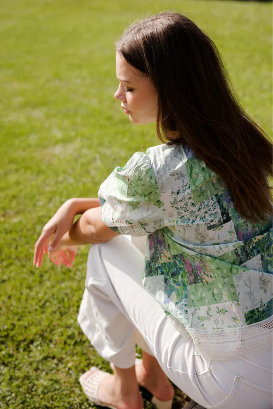 Model wearing Botanical Patch Paige Top By NMBR Rose Available at Beetees Nelson