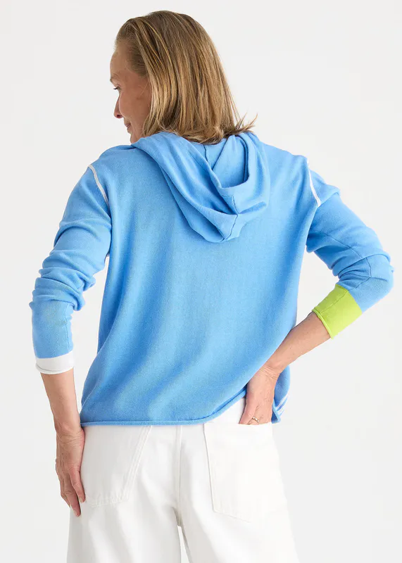 Model wearing Cornflower Sports Hoodie By Zaket & Plover Available at Beetees Nelson
