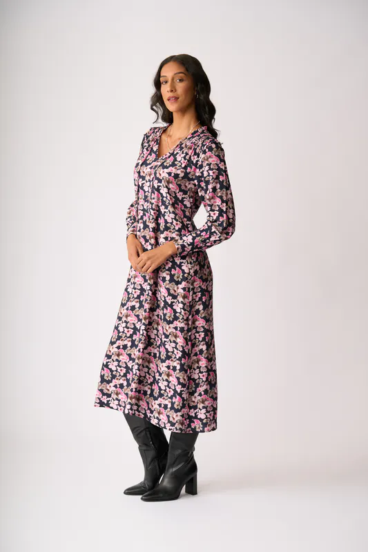 Model wearing Floral Smudge Shirred Shoulder Dress By Foil Available at Beetees Nelson
