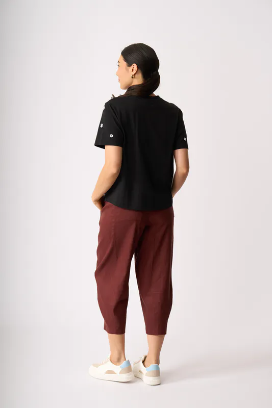 Model wearing Black Floral Embroidered Fun Tshirt By Memo Available at Beetees Nelson