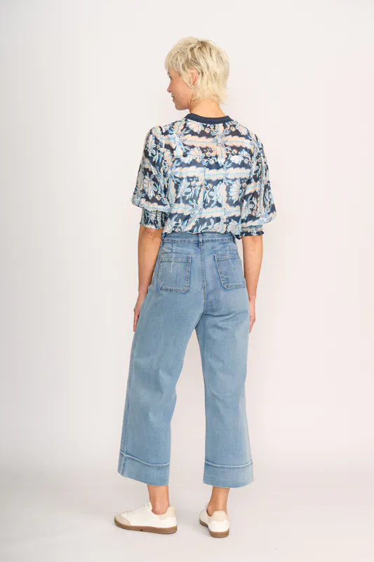 Model wearing Denim Floral Check Leopard Rib Trim Blouse By Memo Available at Beetees Nelson