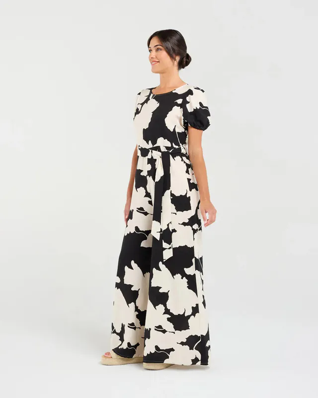 Model wearing Black Waterlily Juliana Tie Waist Jumpsuit By Blackstone Available at Beetees Nelson