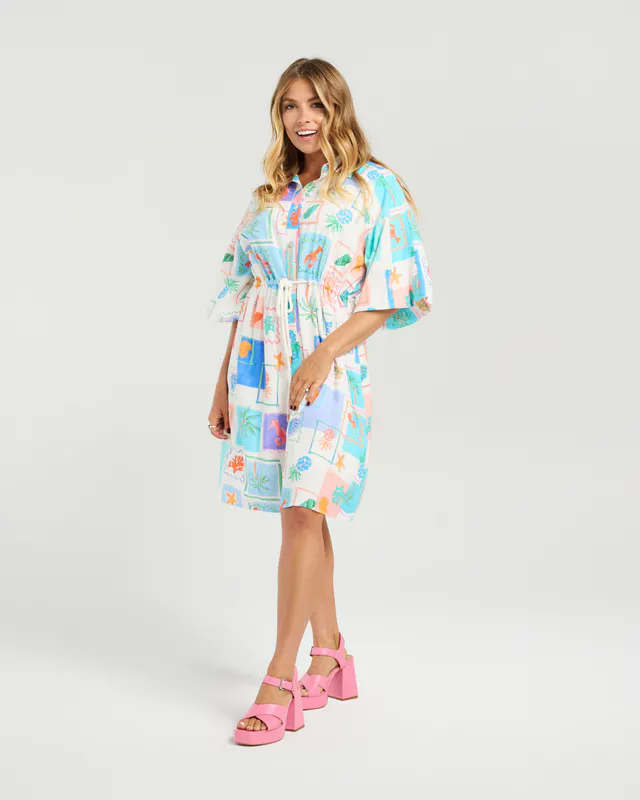 Model wearing Holiday Shells Peyton Dress By NMBR Rose Available at Beetees Nelson