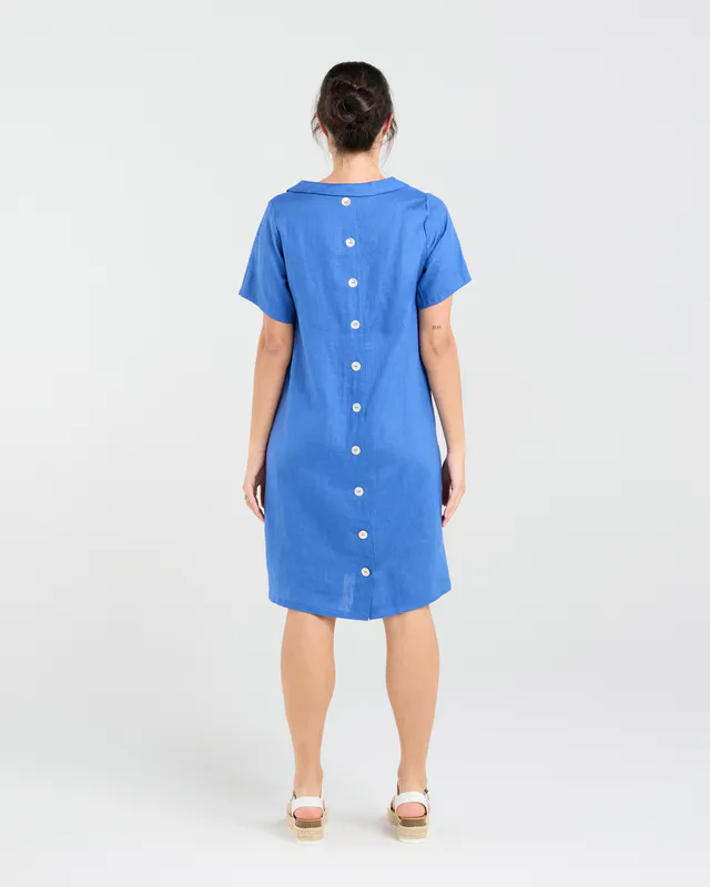 Model wearing Parisian Blue Natacha Linen Button Back Dress By Blackstone Available at Beetees Nelson